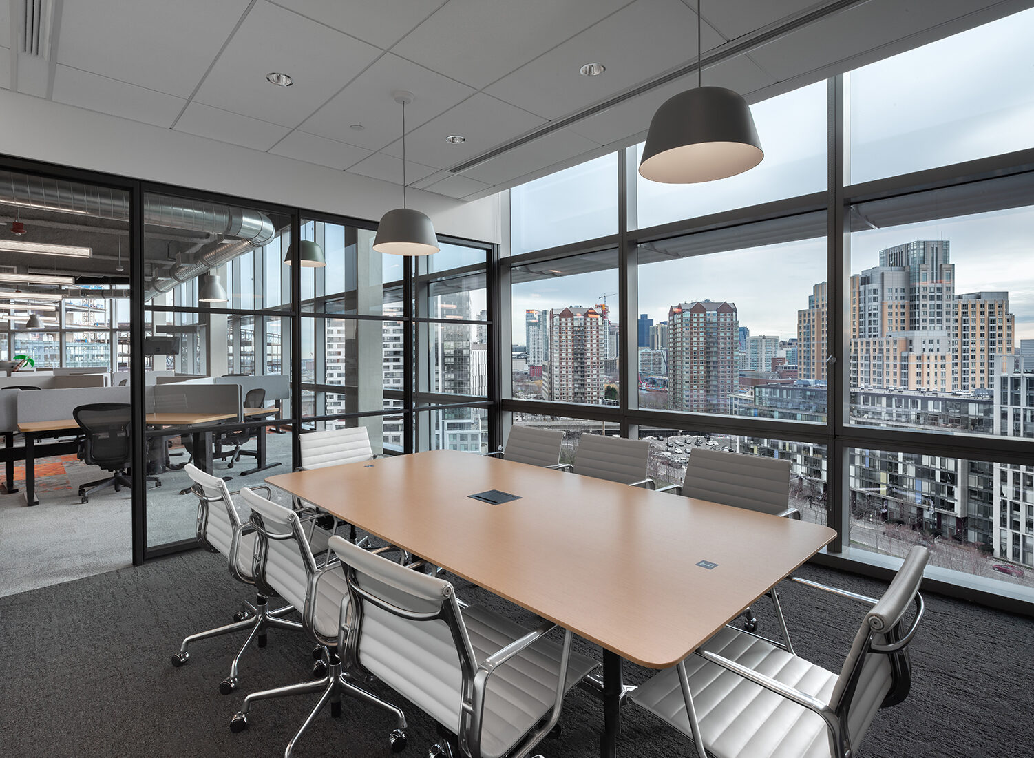 Herman Miller Eames Executive Chairs around conference table at Thrive Headquarters by Creative Office Pavilion